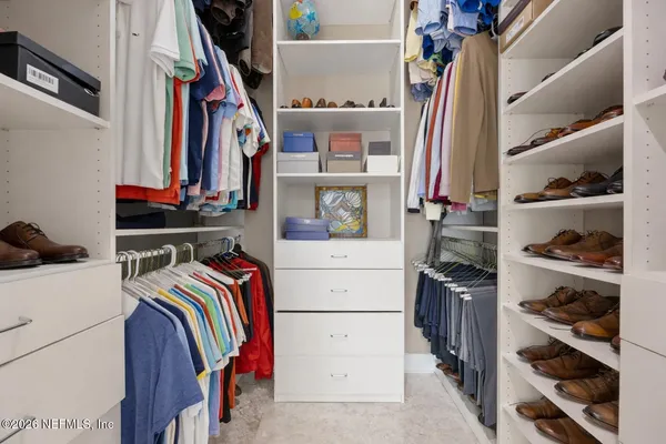 a view of patio with a table and chairs and potted plants