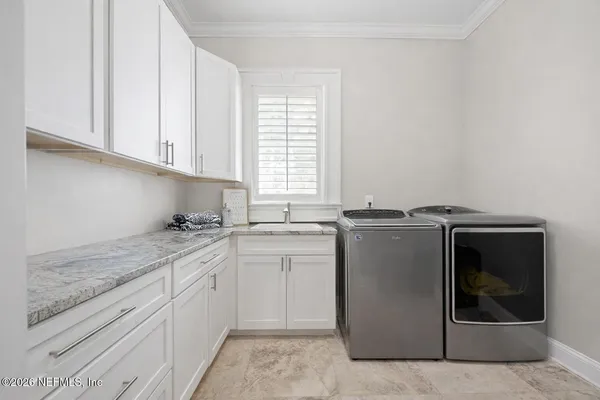 a large tree in front of the house