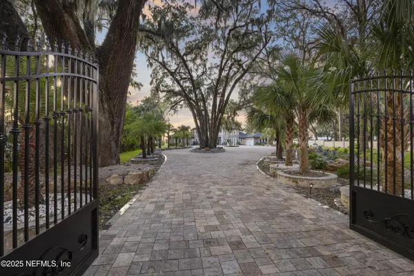 a view of entryway with paintings on the wall