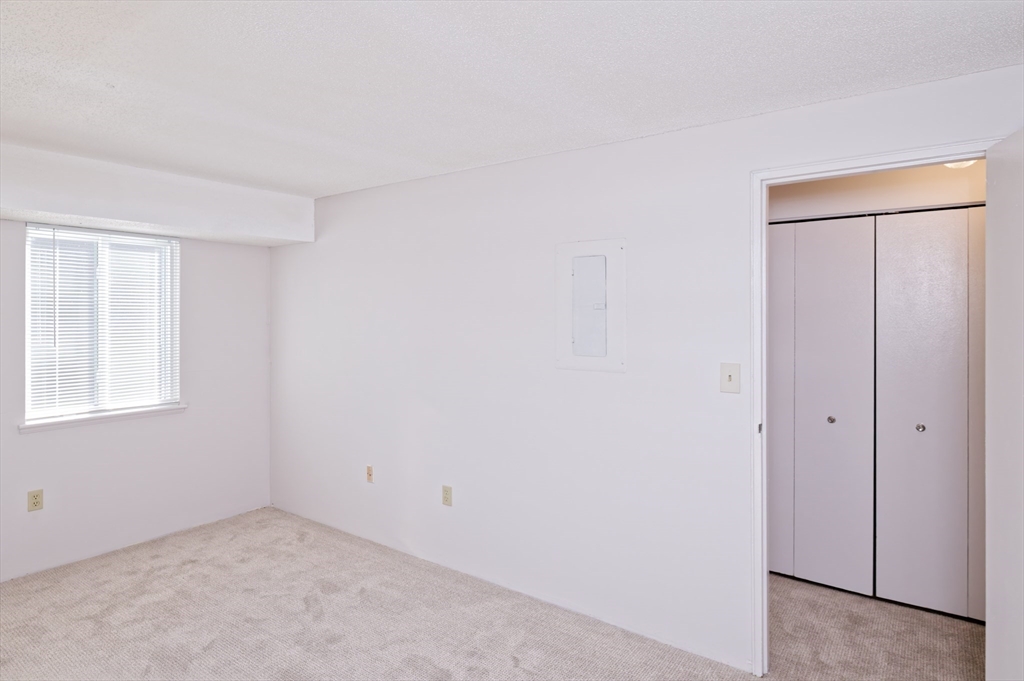 3 Post Oak Lane, Unit 9 Natick, MA 01760 - Photo 18 of 30 a view of an empty room with a window