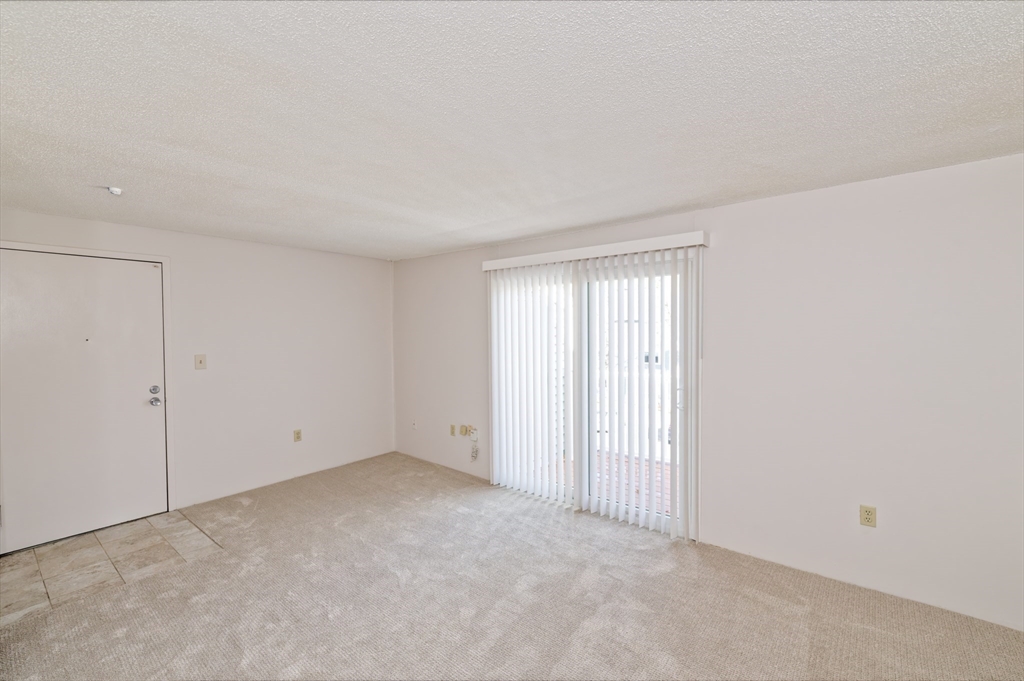 3 Post Oak Lane, Unit 9 Natick, MA 01760 - Photo 2 of 30 a view of an empty room and window