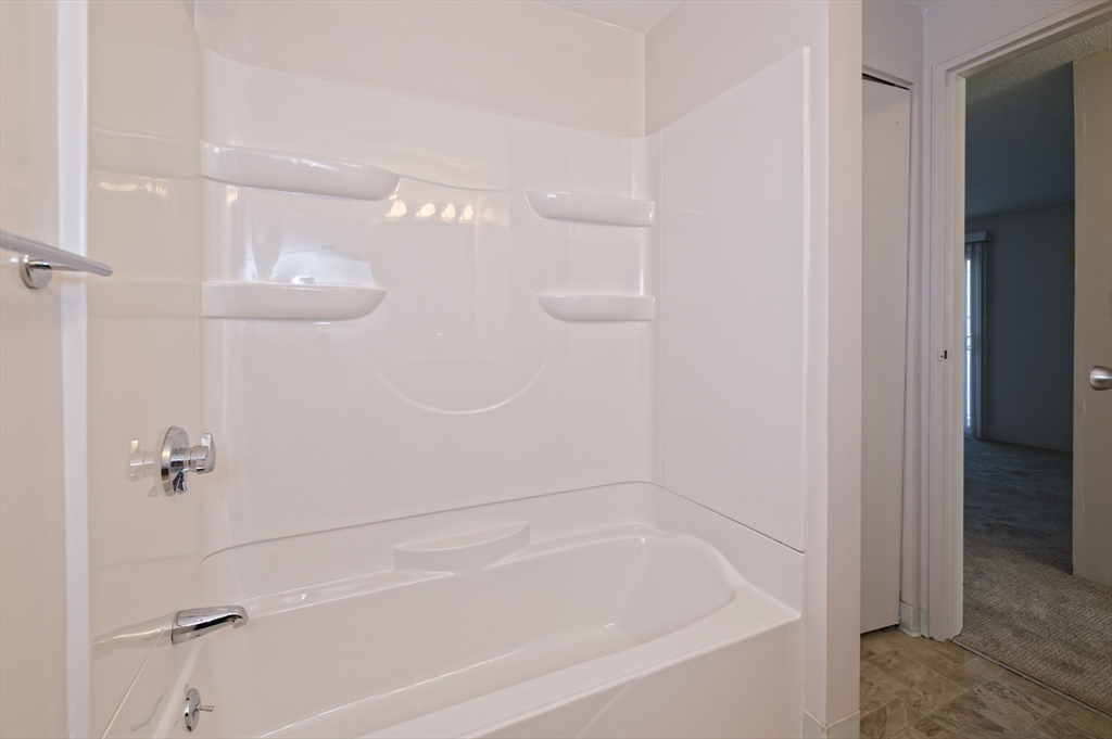 3 Post Oak Lane, Unit 9 Natick, MA 01760 - Photo 23 of 30 a close view of a bathtub in bathroom
