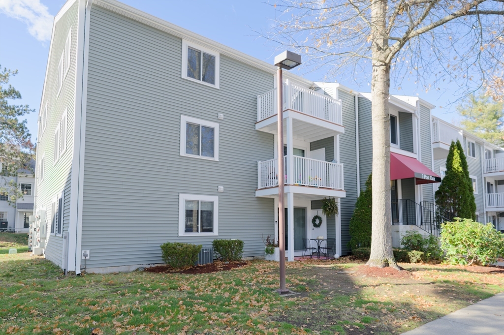 3 Post Oak Lane, Unit 9 Natick, MA 01760 - Photo 26 of 30 a front view of a house with a yard