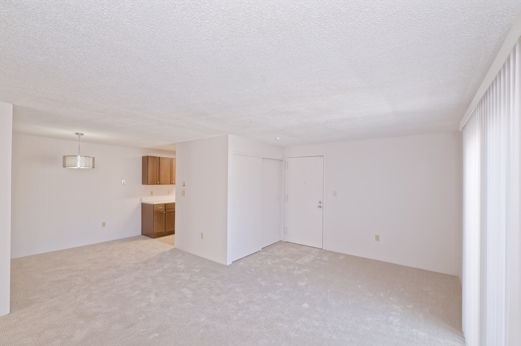 3 Post Oak Lane, Unit 9 Natick, MA 01760 - Photo 3 of 30 a view of an empty room with closet and closet area