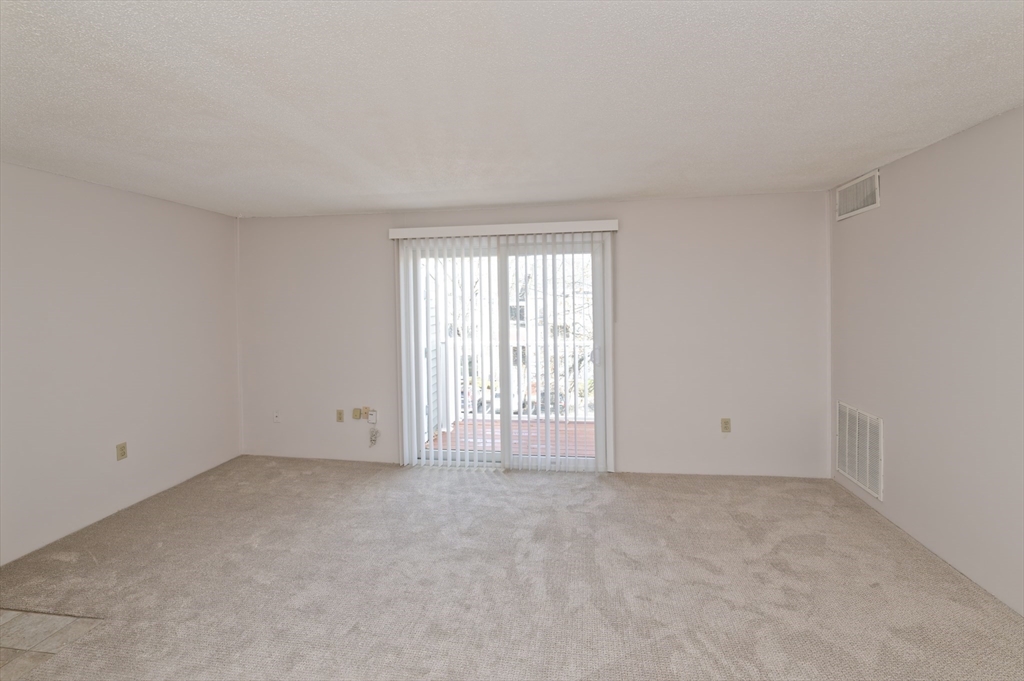 3 Post Oak Lane, Unit 9 Natick, MA 01760 - Photo 6 of 30 a view of an empty room with a window