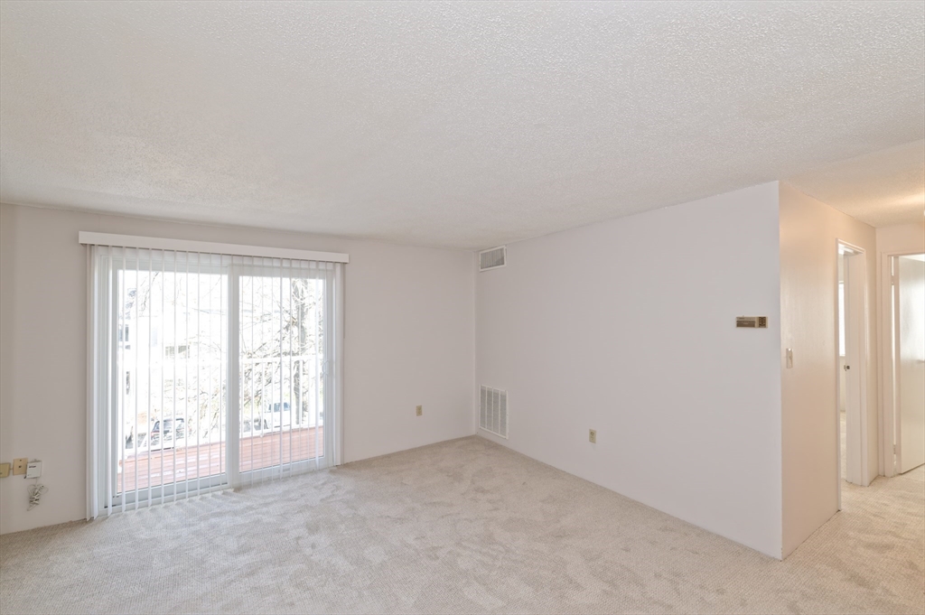 3 Post Oak Lane, Unit 9 Natick, MA 01760 - Photo 8 of 30 an empty room with windows