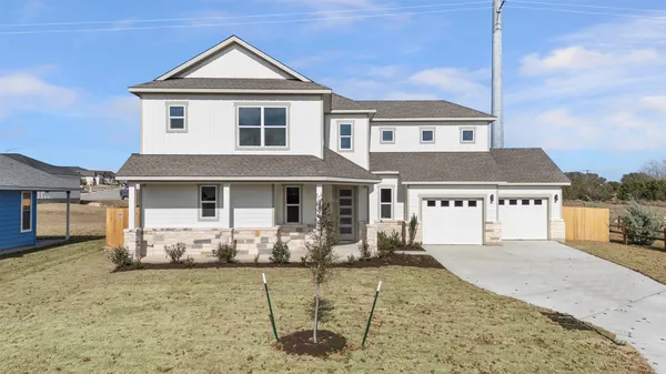 a front view of a house with yard