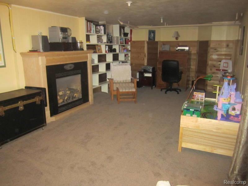 304 Mission Road Sault Ste. Marie, MI 49783 - Photo 23 of 25 Basement family room.jpg