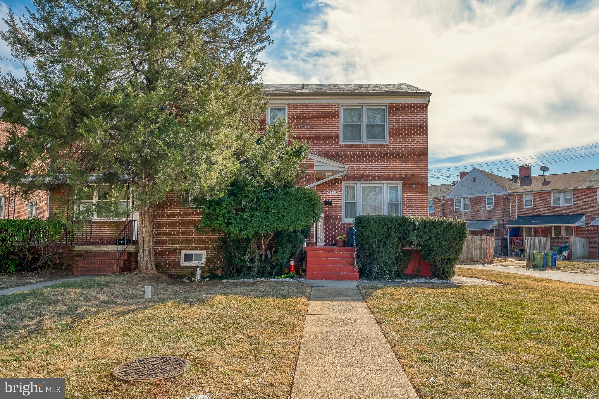 4023 Fallstaff Road Baltimore, MD 21215 - Photo 1 of 22 a front view of a house with a yard