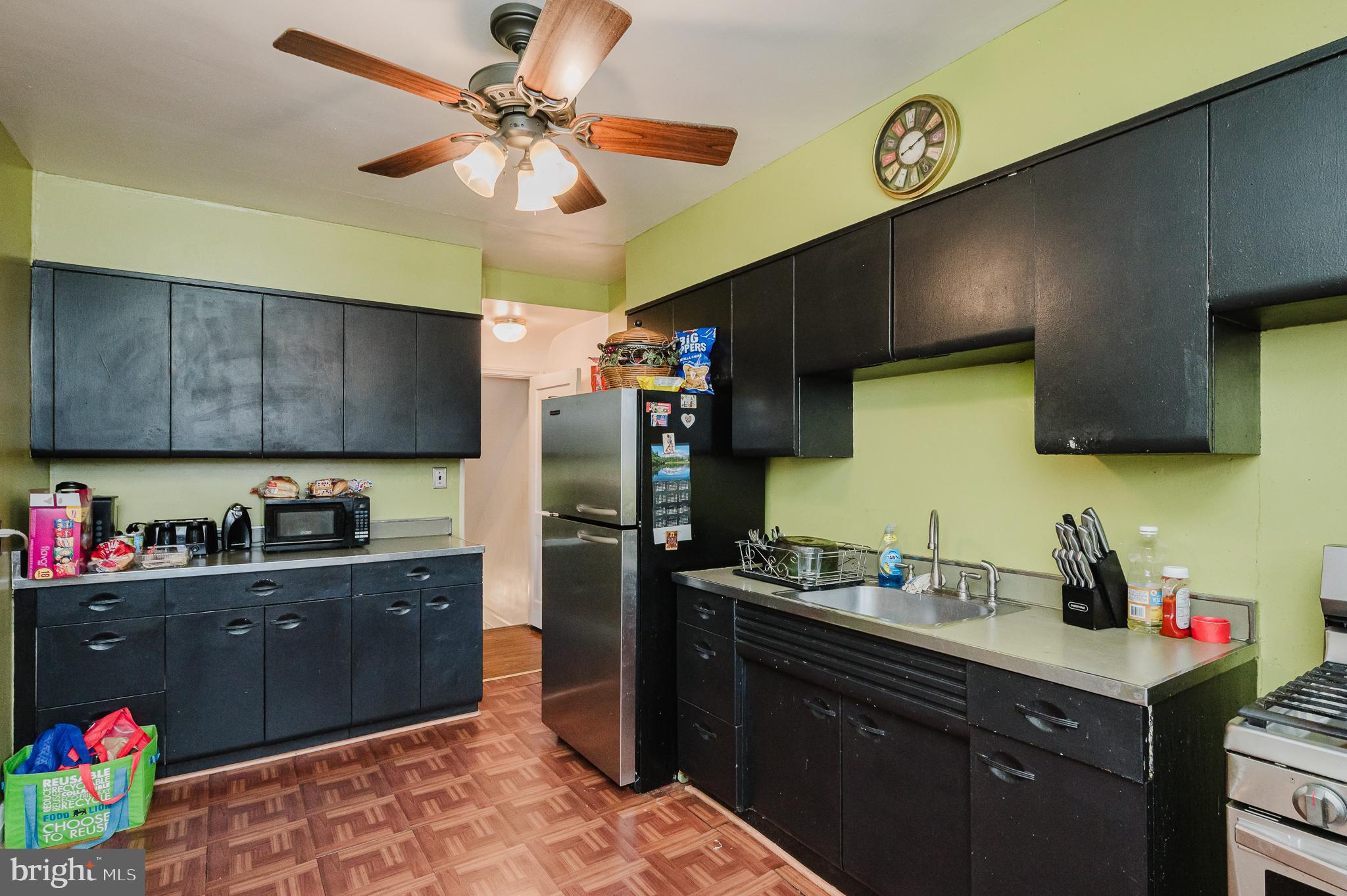 4023 Fallstaff Road Baltimore, MD 21215 - Photo 11 of 22 a kitchen with a sink dishwasher and a refrigerator