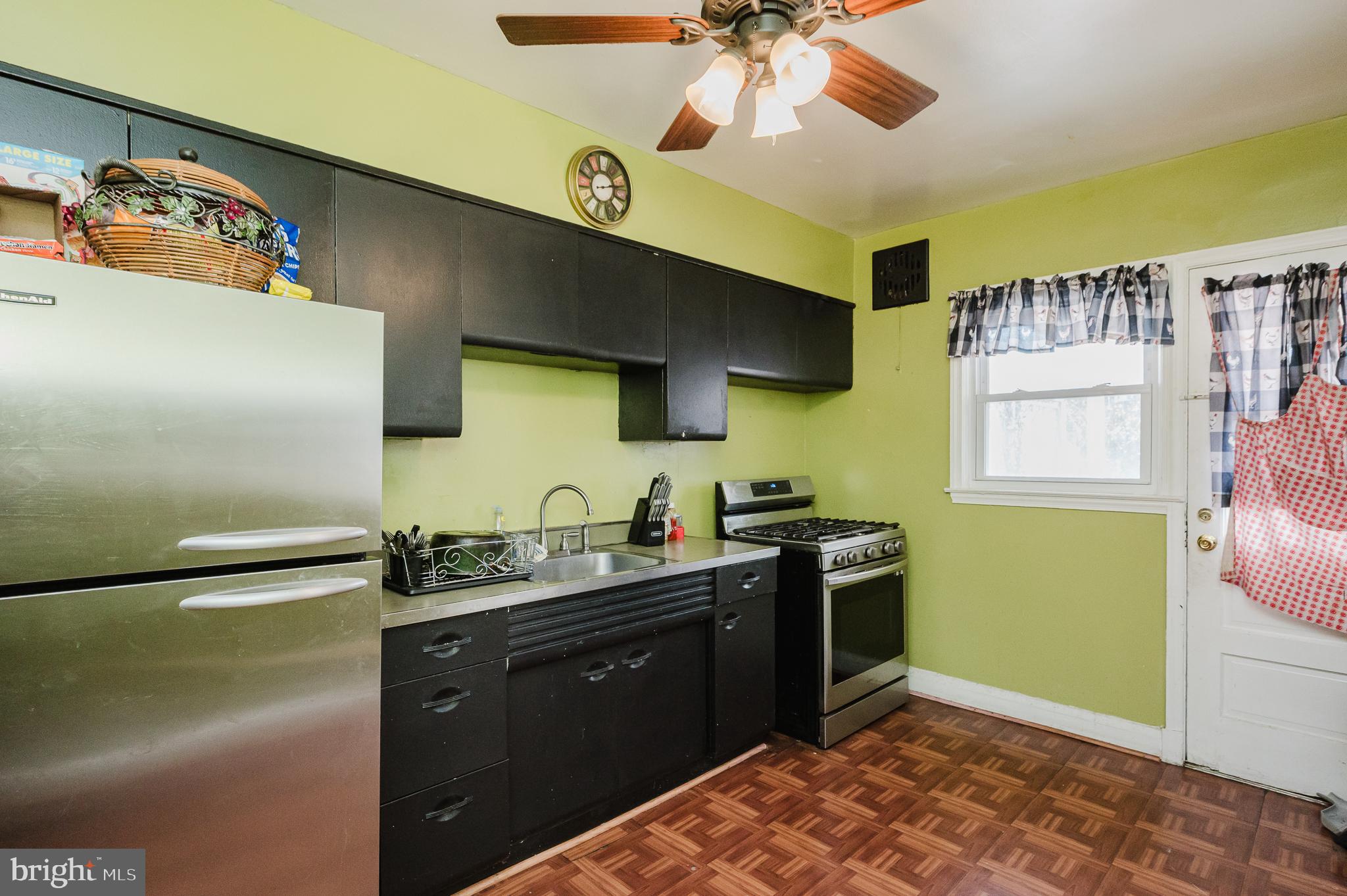 4023 Fallstaff Road Baltimore, MD 21215 - Photo 12 of 22 a kitchen with a sink appliances and cabinets