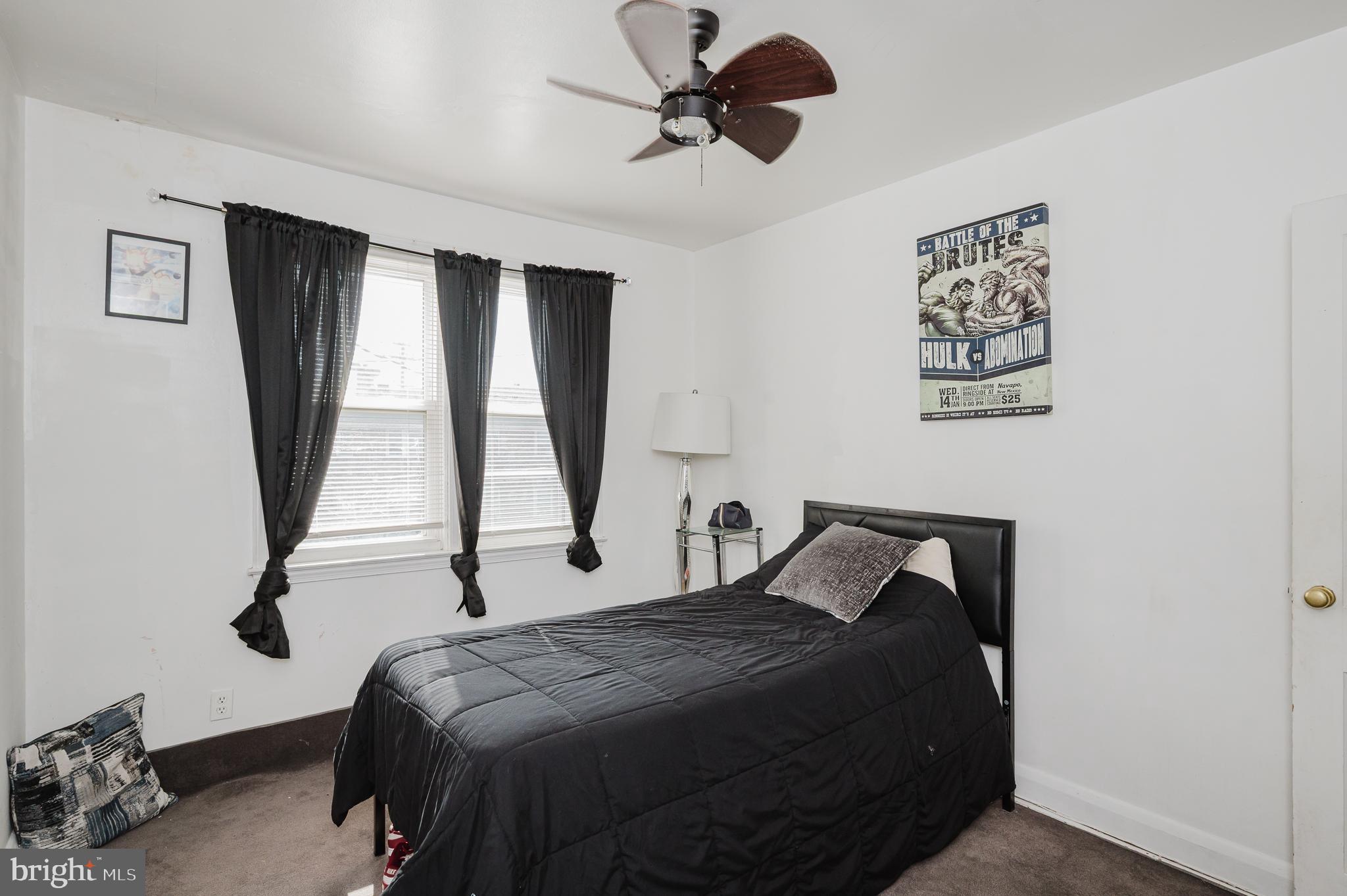4023 Fallstaff Road Baltimore, MD 21215 - Photo 16 of 22 a bedroom with a bed and a window