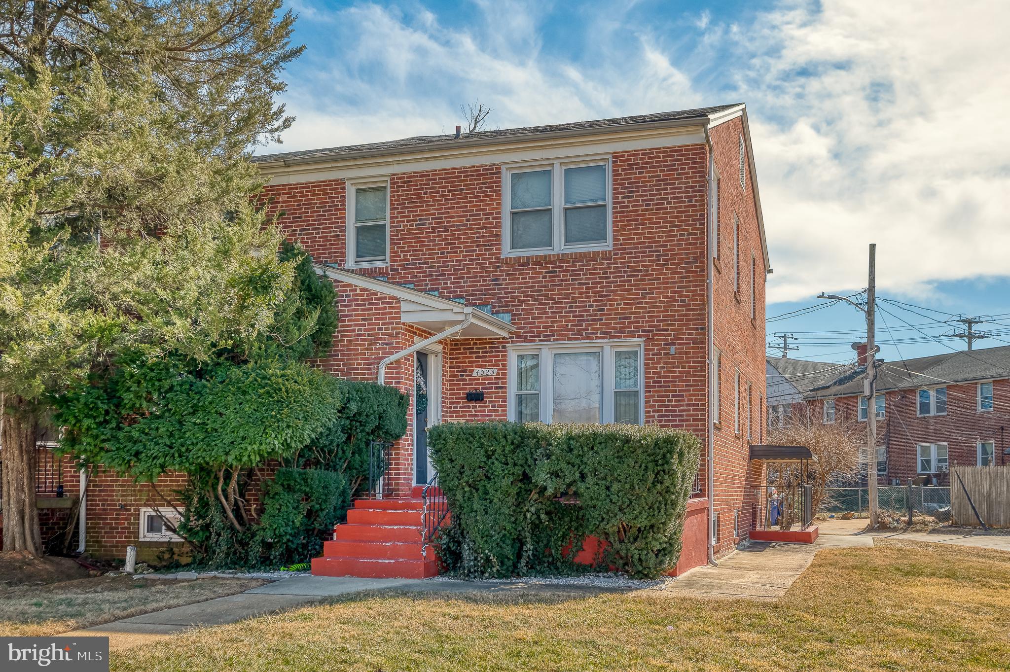 4023 Fallstaff Road Baltimore, MD 21215 - Photo 2 of 22 a front view of a house with a yard