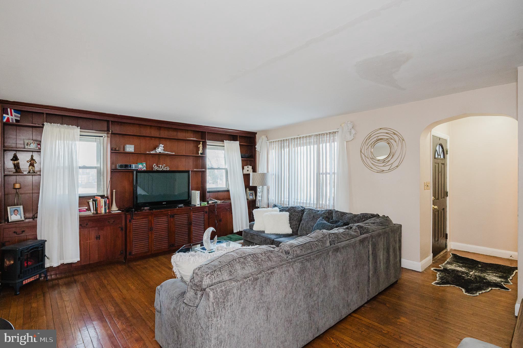 4023 Fallstaff Road Baltimore, MD 21215 - Photo 5 of 22 a living room with furniture and a flat screen tv