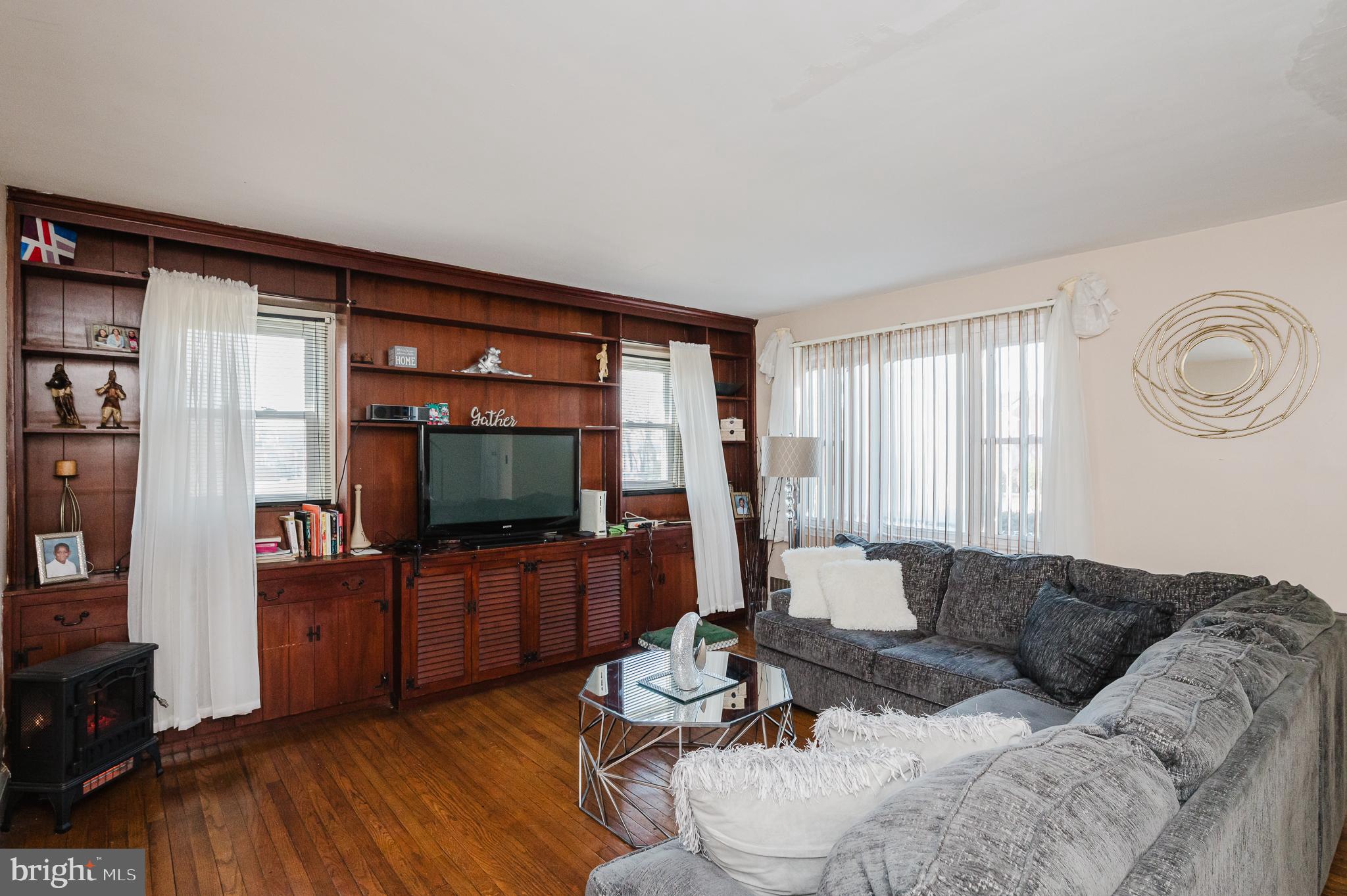 4023 Fallstaff Road Baltimore, MD 21215 - Photo 6 of 22 a living room with furniture and a flat screen tv