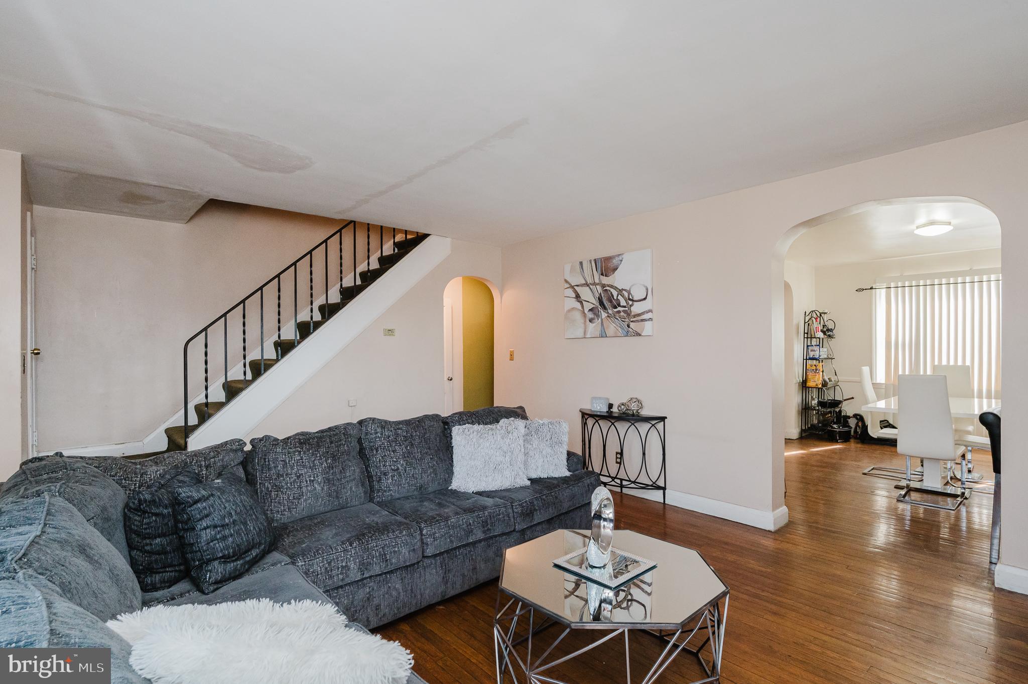 4023 Fallstaff Road Baltimore, MD 21215 - Photo 7 of 22 a living room with furniture and wooden floor