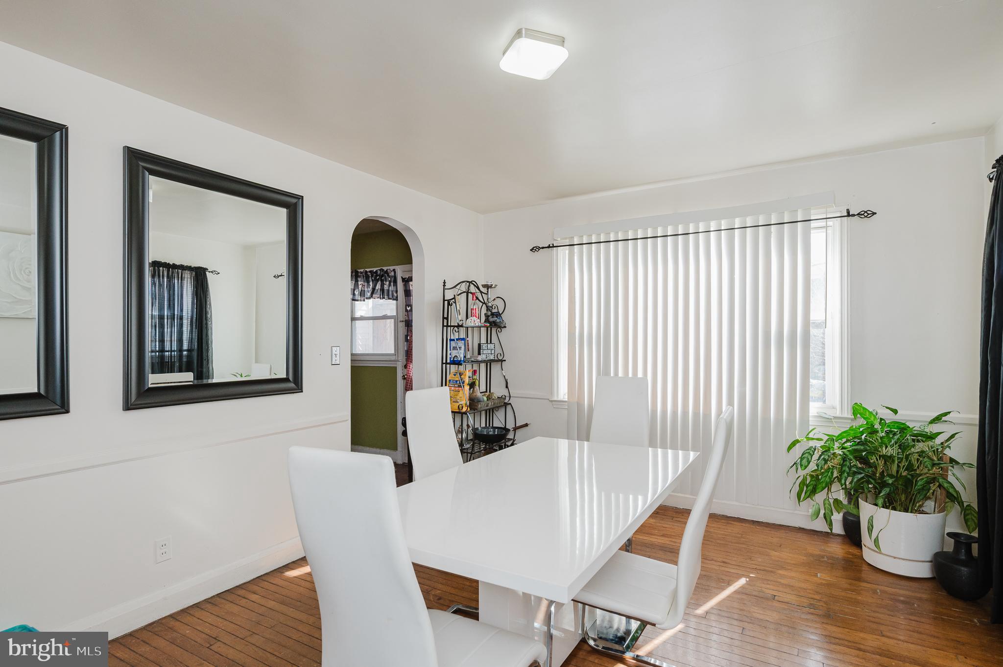 4023 Fallstaff Road Baltimore, MD 21215 - Photo 9 of 22 a view of a dining room with furniture window and wooden floor