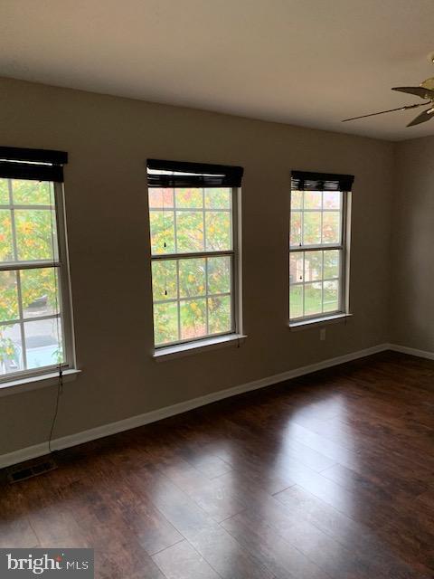 16 Cinzano Court Gaithersburg, MD 20878 - Photo 11 of 22 a view of an empty room with wooden floor and a window