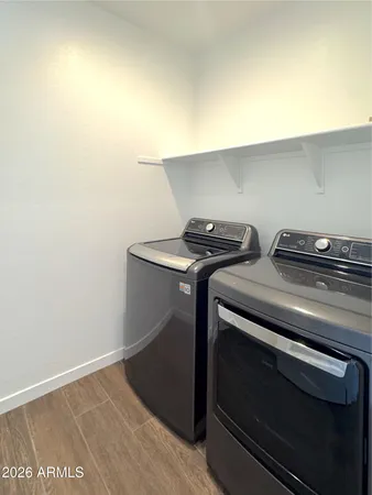 a utility room with dryer and washer