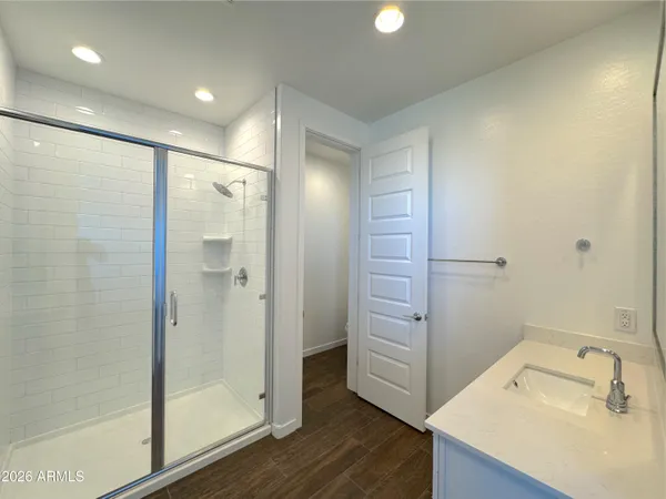 a bathroom with a sink and shower