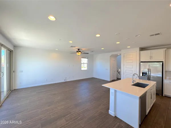 a view of kitchen island with tub and windows
