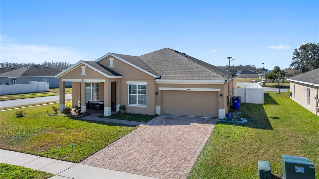 3548 Cayugas Loop St. Cloud, FL 34772 - Photo 1 of 1 a view of a house with a yard and patio