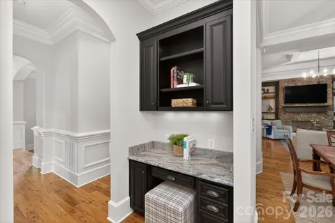 a view of kitchen with cabinets and wooden floor
