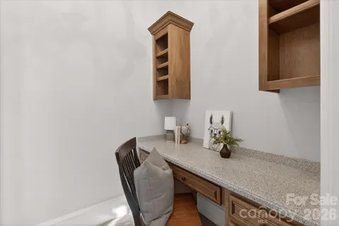 a bathroom with a granite countertop sink a mirror and vanity