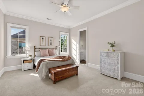 a bed room with a bed and a window