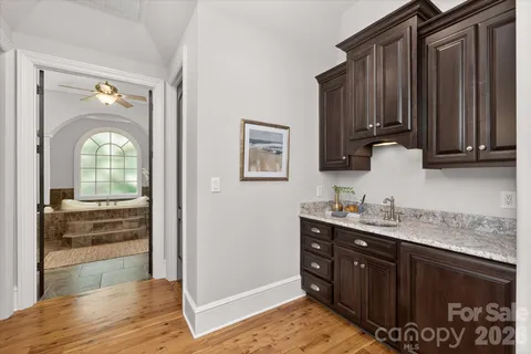a kitchen with a sink and cabinets