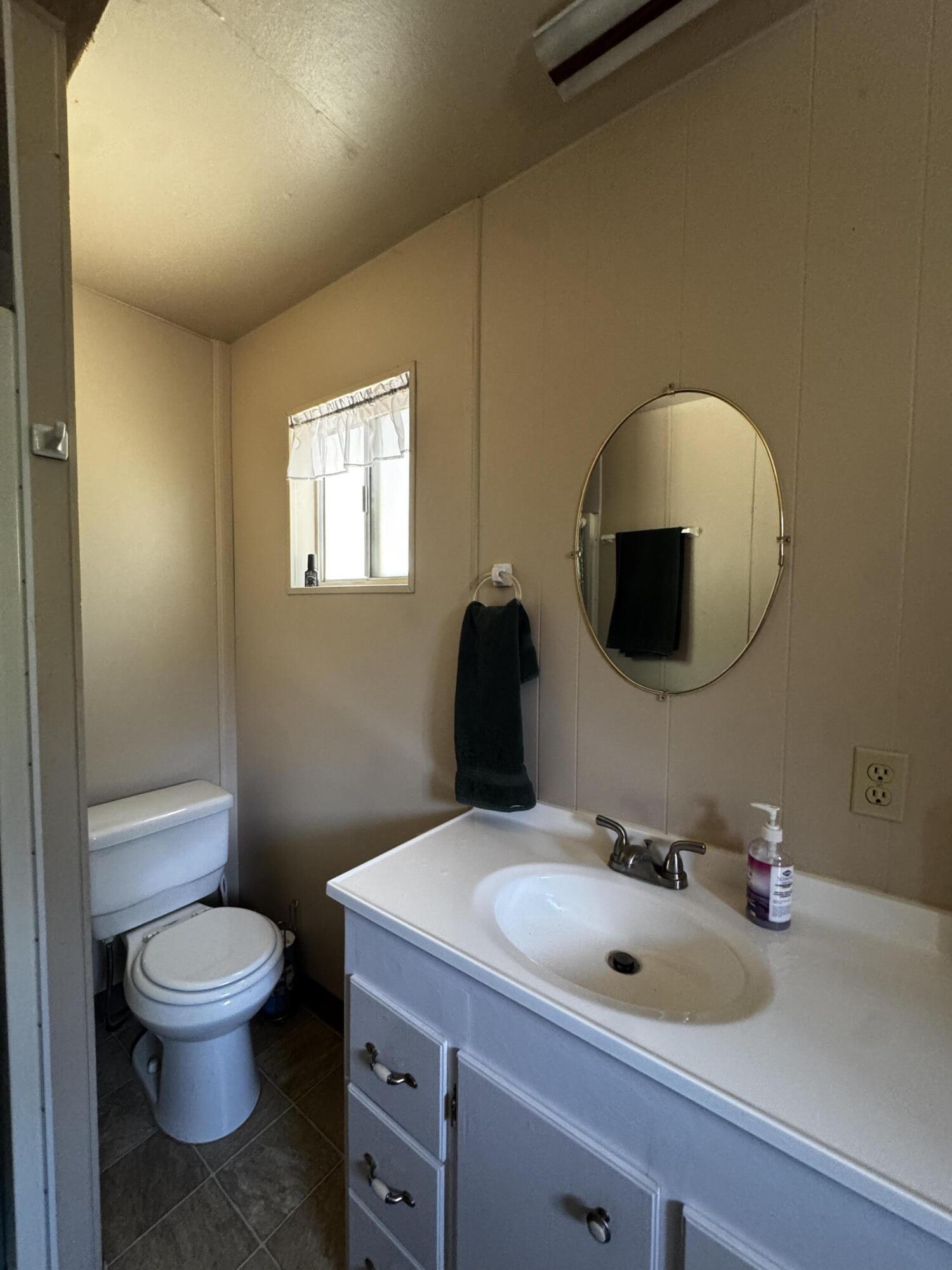 52670 Forest Rte 4S02 Idyllwild, CA 92549 - Photo 17 of 51 a bathroom with a toilet sink and mirror