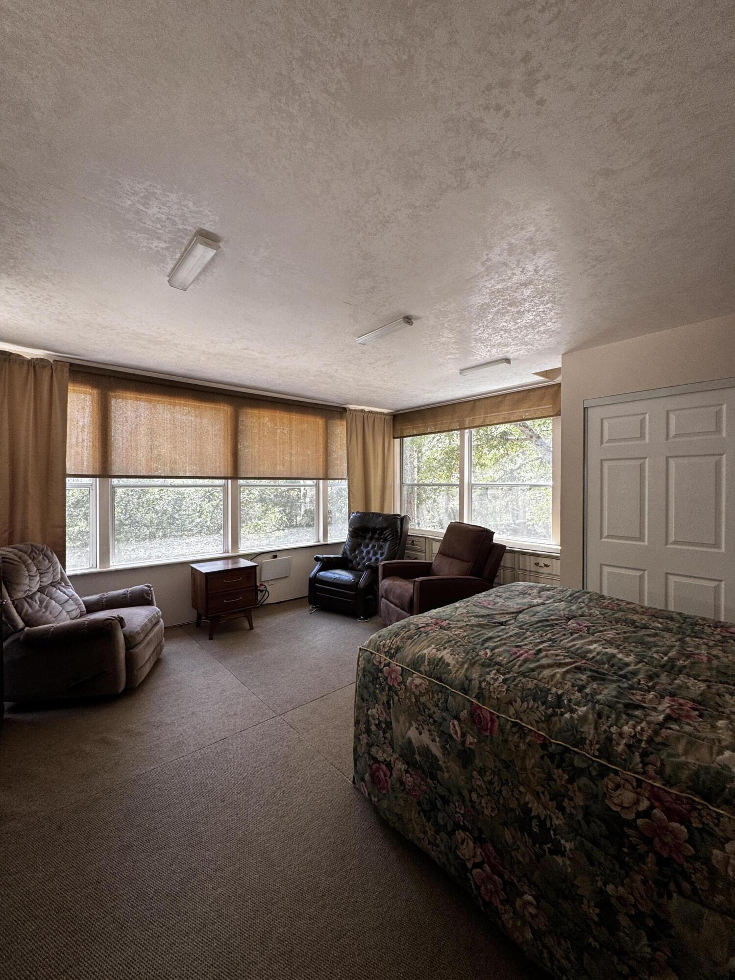52670 Forest Rte 4S02 Idyllwild, CA 92549 - Photo 23 of 51 a living room with furniture and large windows