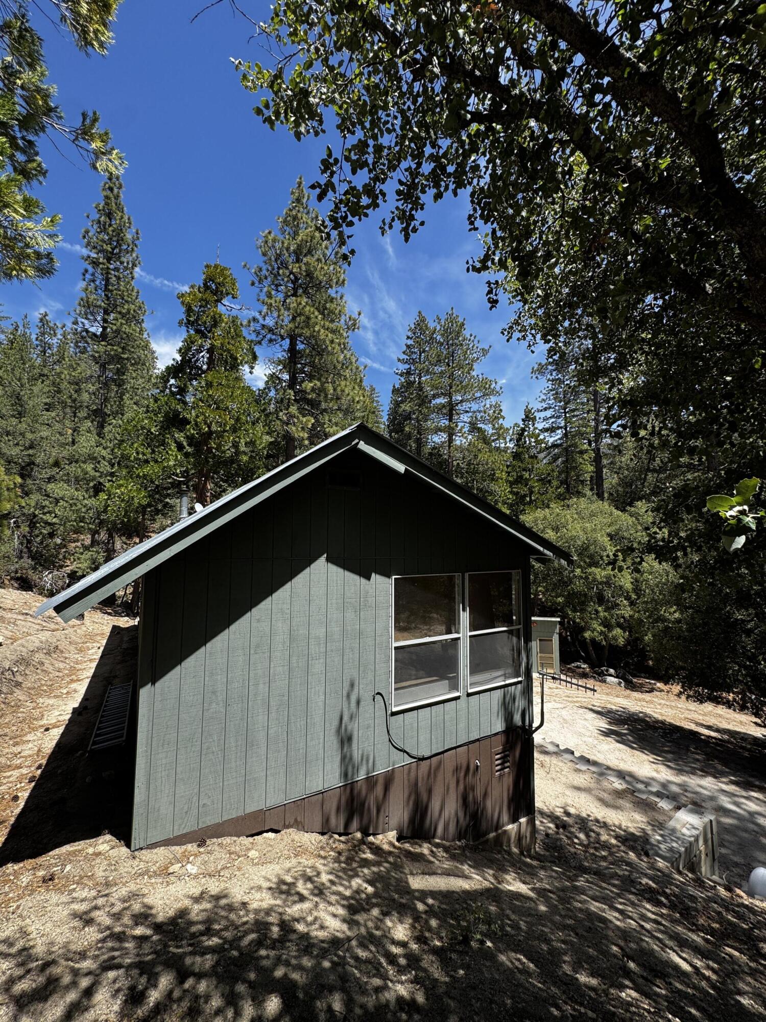 52670 Forest Rte 4S02 Idyllwild, CA 92549 - Photo 6 of 51 a front view of a house with a yard