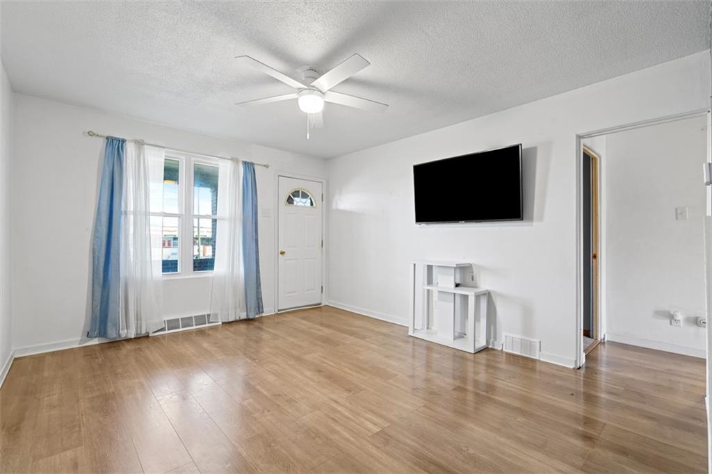 3144 Leechburg Road Lower Burrell, PA 15068 - Photo 11 of 47 a view of a livingroom with a flat screen tv