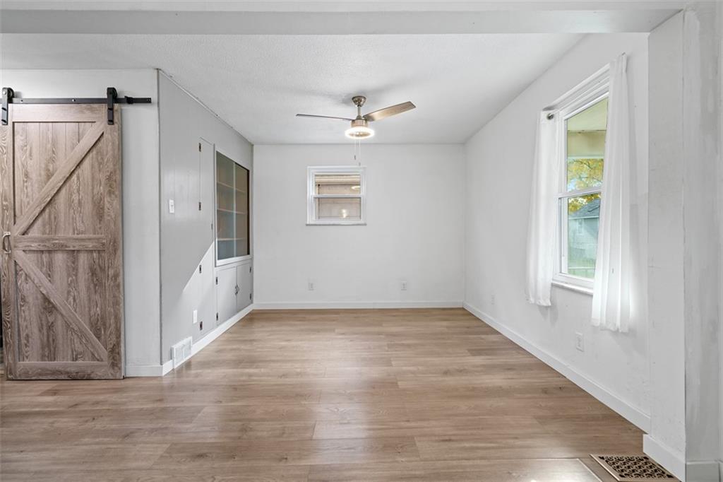 3144 Leechburg Road Lower Burrell, PA 15068 - Photo 19 of 47 an empty room with windows and fan