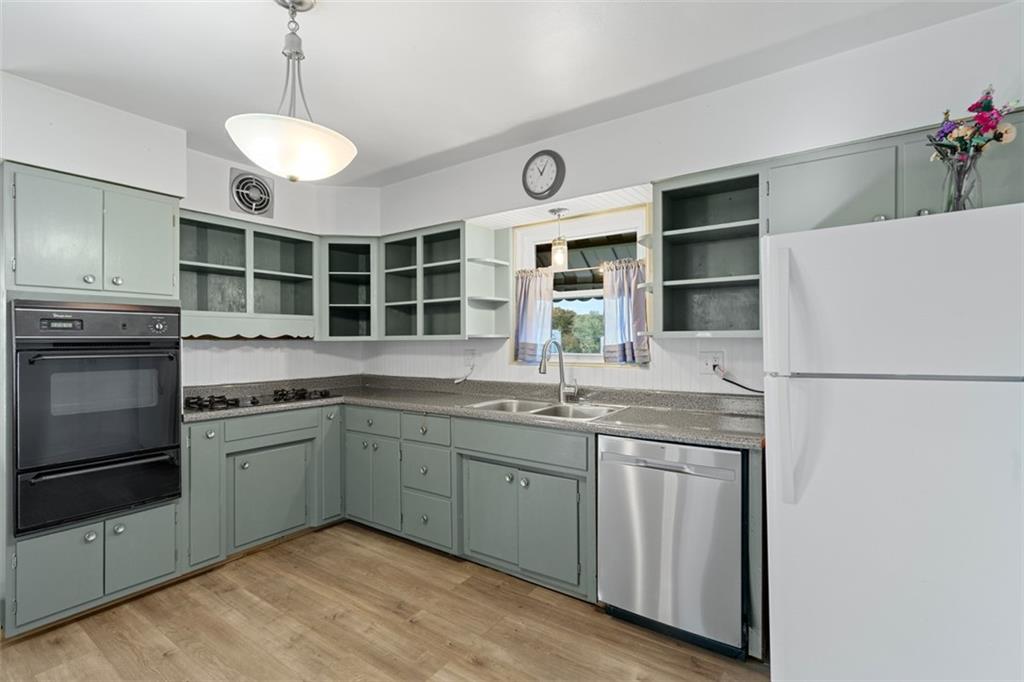 3144 Leechburg Road Lower Burrell, PA 15068 - Photo 21 of 47 a kitchen with a sink stove and refrigerator