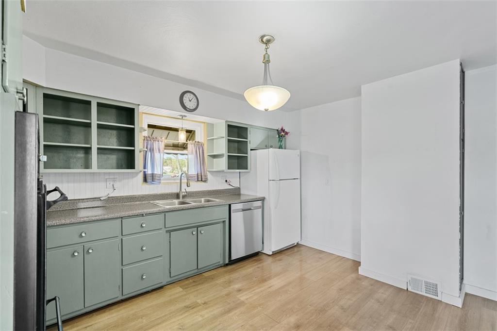 3144 Leechburg Road Lower Burrell, PA 15068 - Photo 22 of 47 a kitchen with stainless steel appliances a sink and a window
