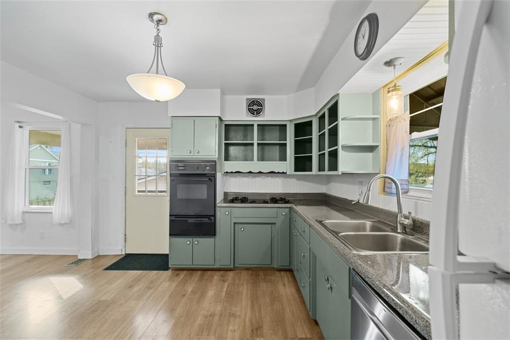 3144 Leechburg Road Lower Burrell, PA 15068 - Photo 23 of 47 a kitchen with stainless steel appliances granite countertop a sink a stove and a refrigerator