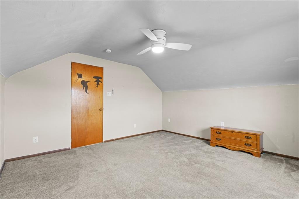 3144 Leechburg Road Lower Burrell, PA 15068 - Photo 28 of 47 an empty room with a chandelier fan and a chandelier fan