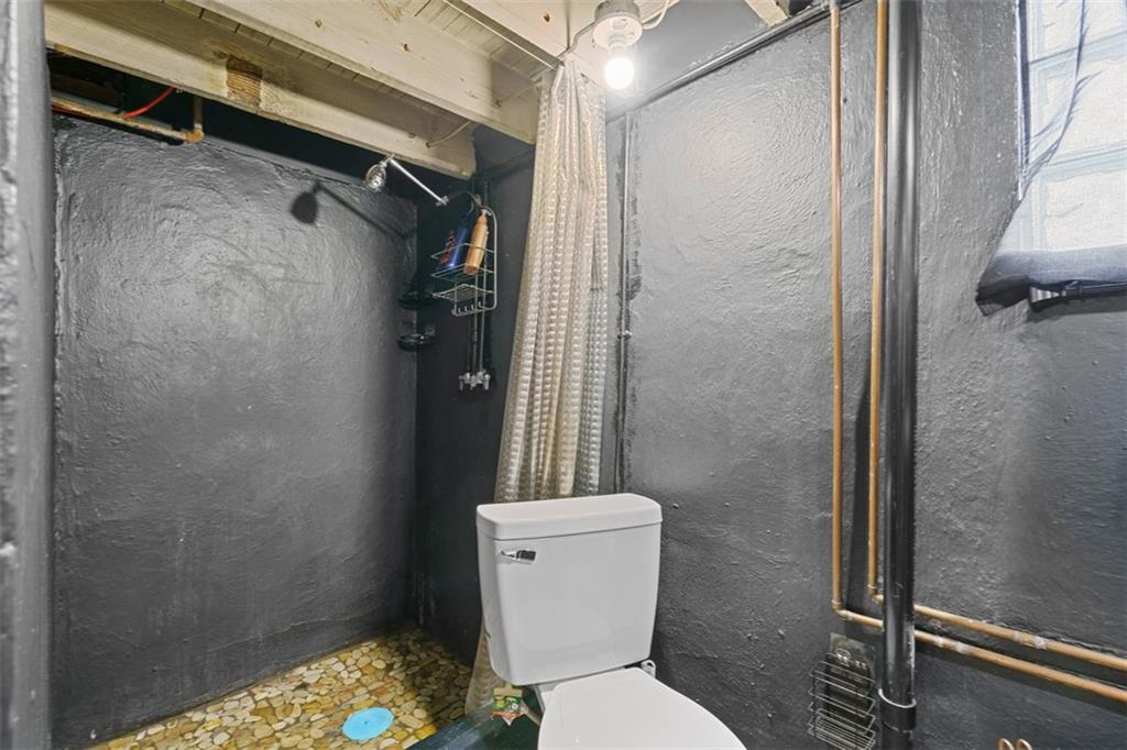 3144 Leechburg Road Lower Burrell, PA 15068 - Photo 36 of 47 a white toilet sitting next to a shower