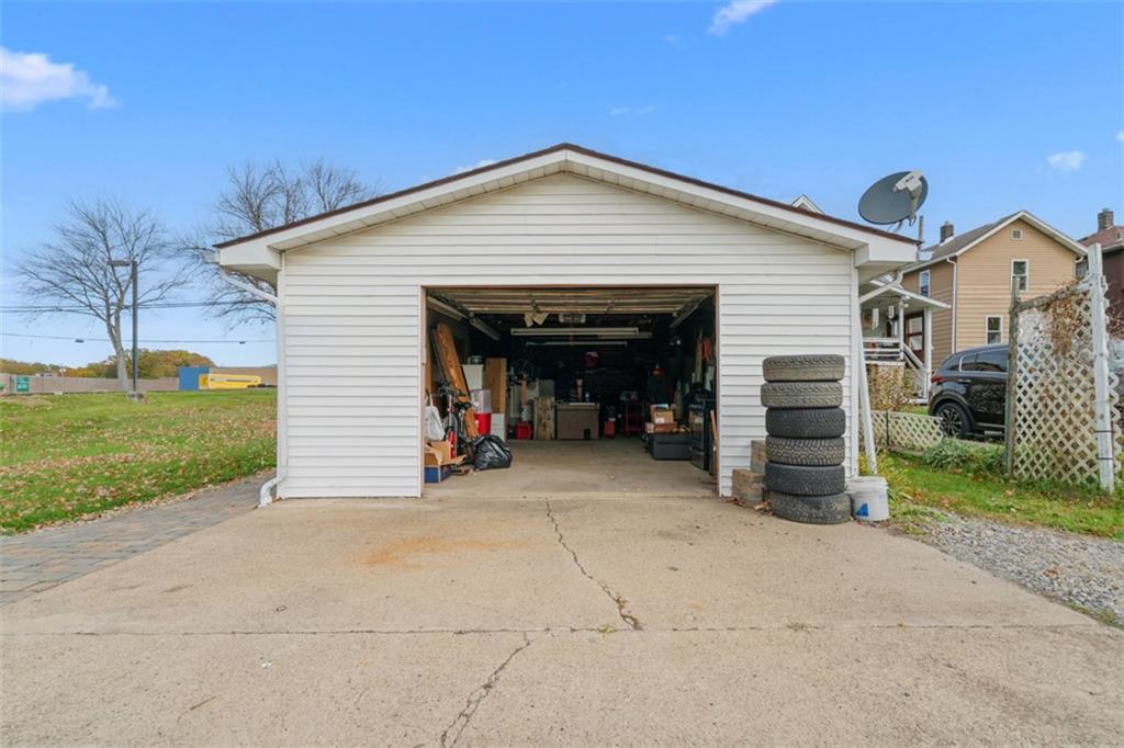 3144 Leechburg Road Lower Burrell, PA 15068 - Photo 43 of 47 a view of a house with a yard and garage