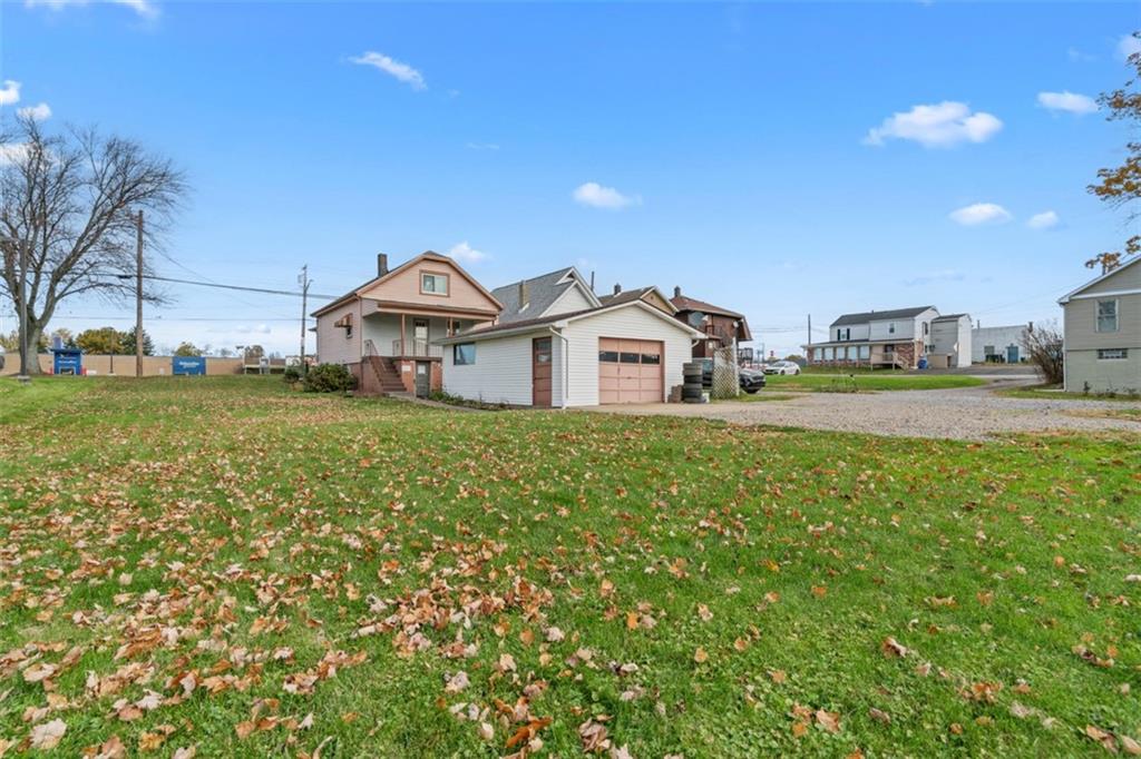 3144 Leechburg Road Lower Burrell, PA 15068 - Photo 45 of 47 a view of a house with a big yard and large trees