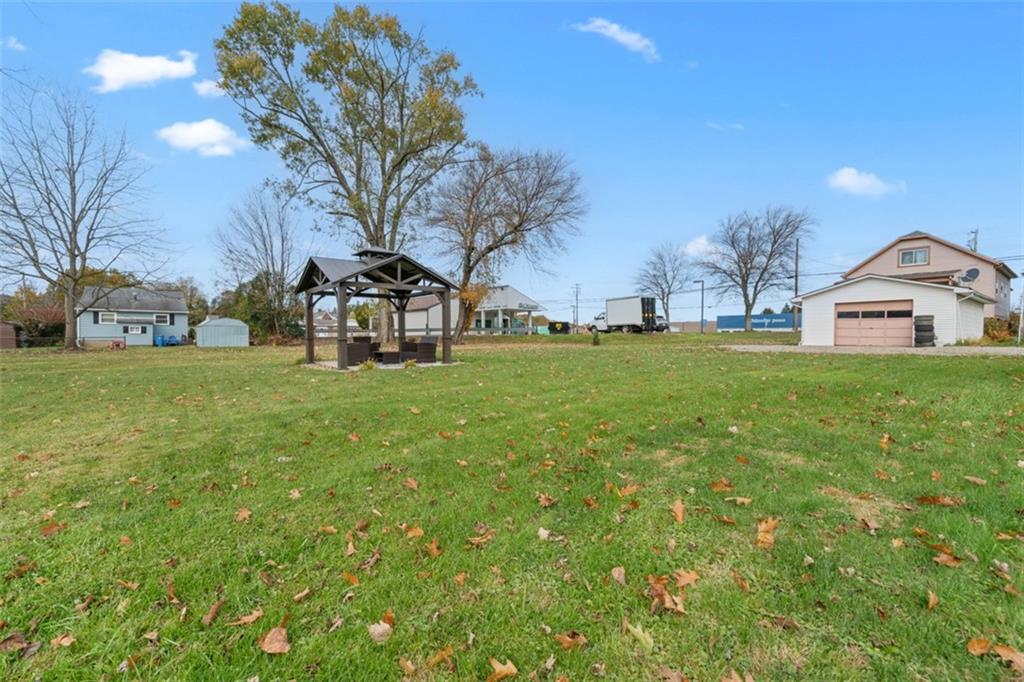 3144 Leechburg Road Lower Burrell, PA 15068 - Photo 47 of 47 a tall tree sitting in front of a house with a big yard