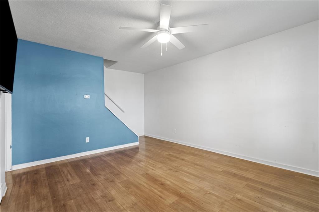 3144 Leechburg Road Lower Burrell, PA 15068 - Photo 10 of 47 a view of an empty room with wooden floor