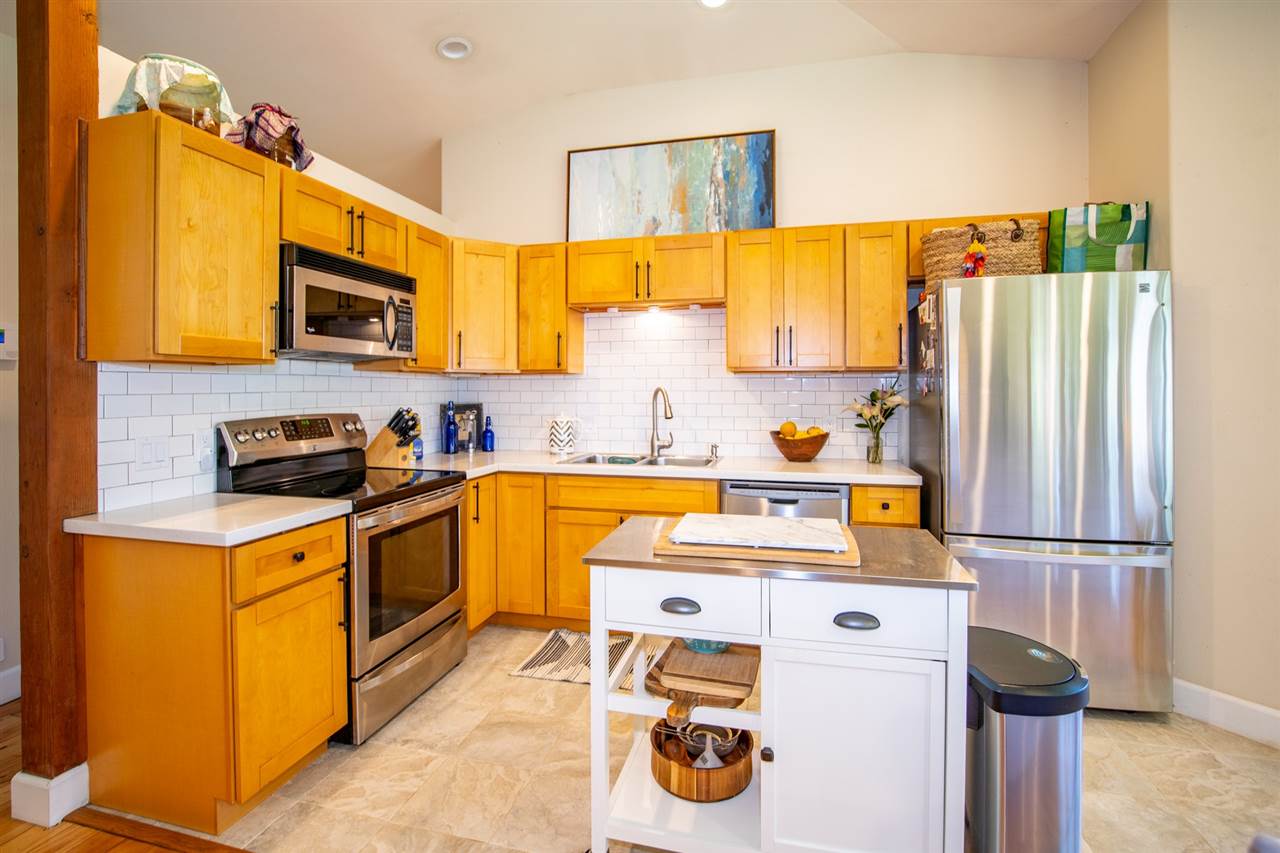 180 Waiakoa Road Kula, HI 96790 - Photo 11 of 27 a kitchen with a sink a stove and a refrigerator