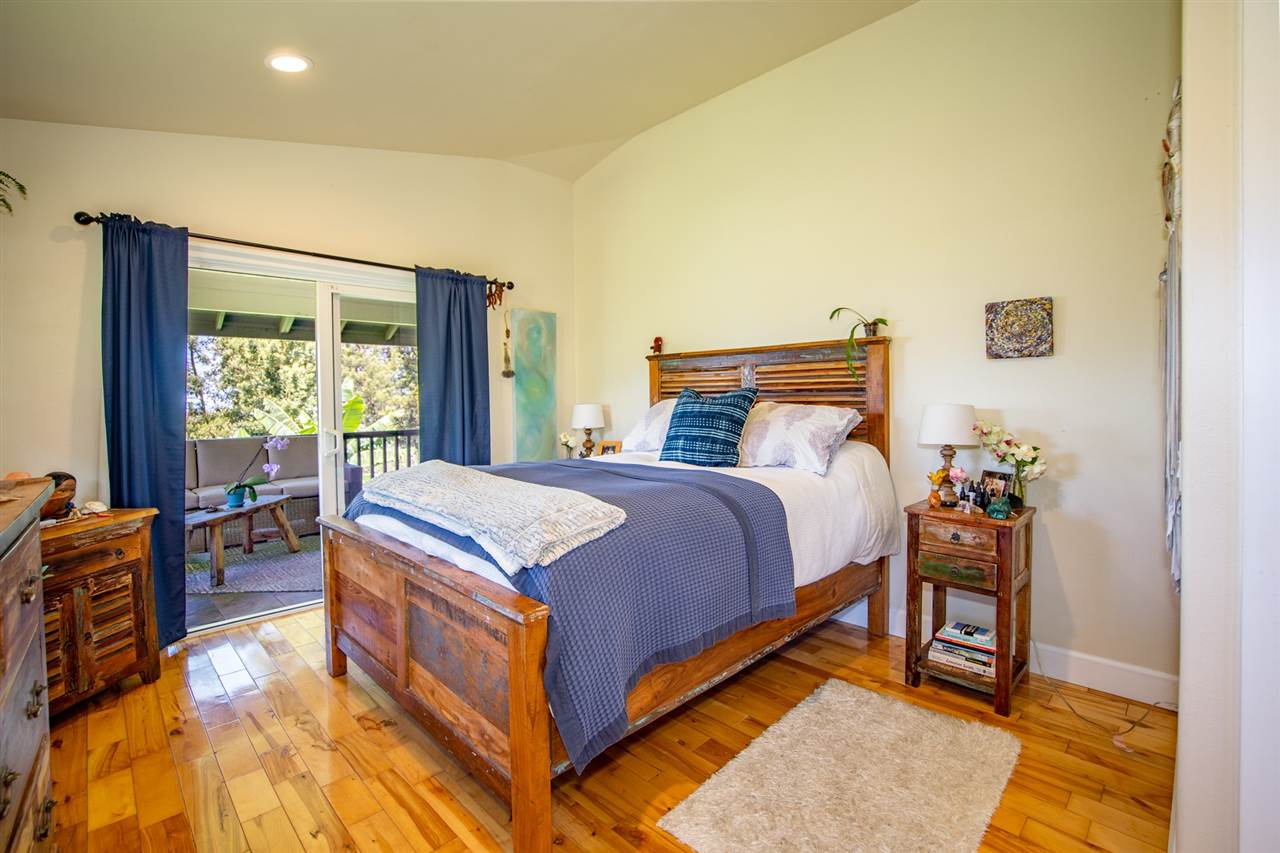 180 Waiakoa Road Kula, HI 96790 - Photo 12 of 27 a bed room with a bed and a chair