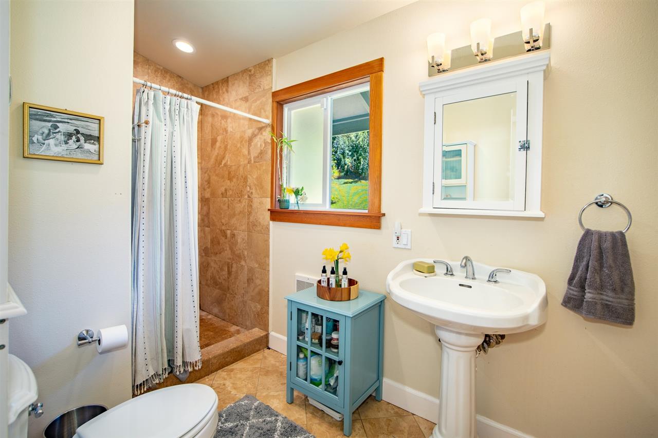 180 Waiakoa Road Kula, HI 96790 - Photo 14 of 27 a bathroom with a sink mirror and toilet