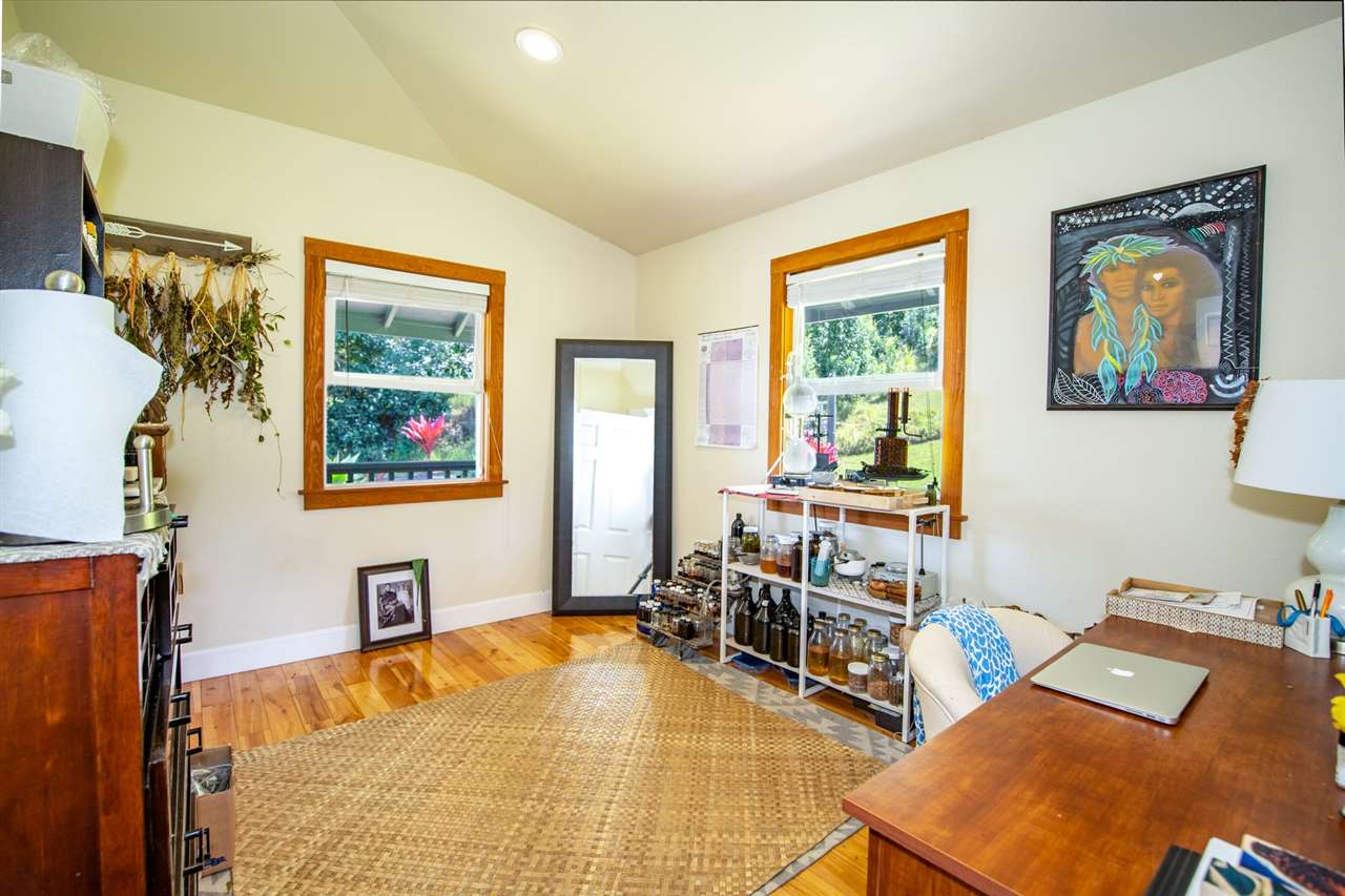 180 Waiakoa Road Kula, HI 96790 - Photo 17 of 27 a bedroom with furniture and a large window