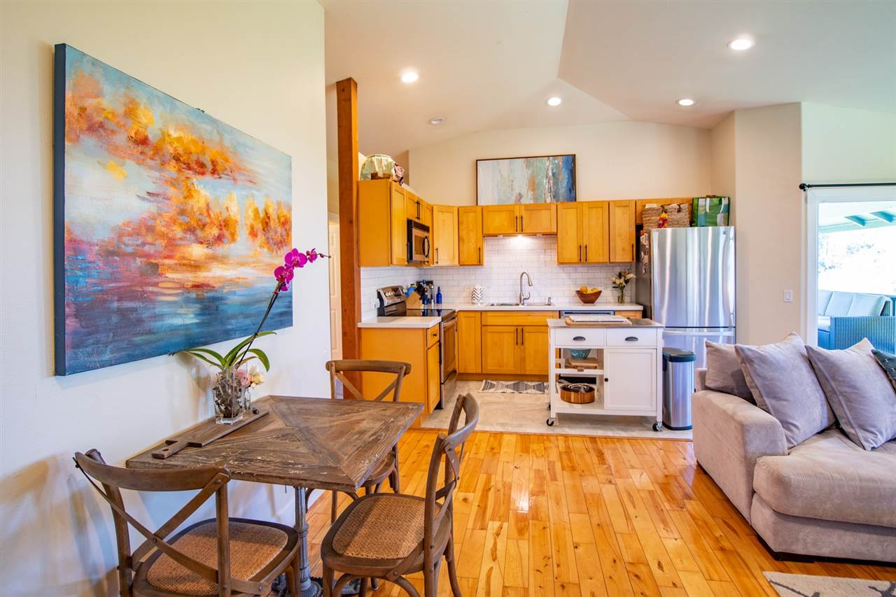 180 Waiakoa Road Kula, HI 96790 - Photo 6 of 27 a living room with furniture and a flat screen tv