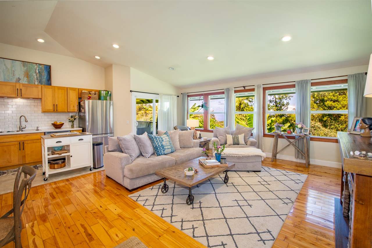 180 Waiakoa Road Kula, HI 96790 - Photo 7 of 27 a living room with furniture fireplace and a table
